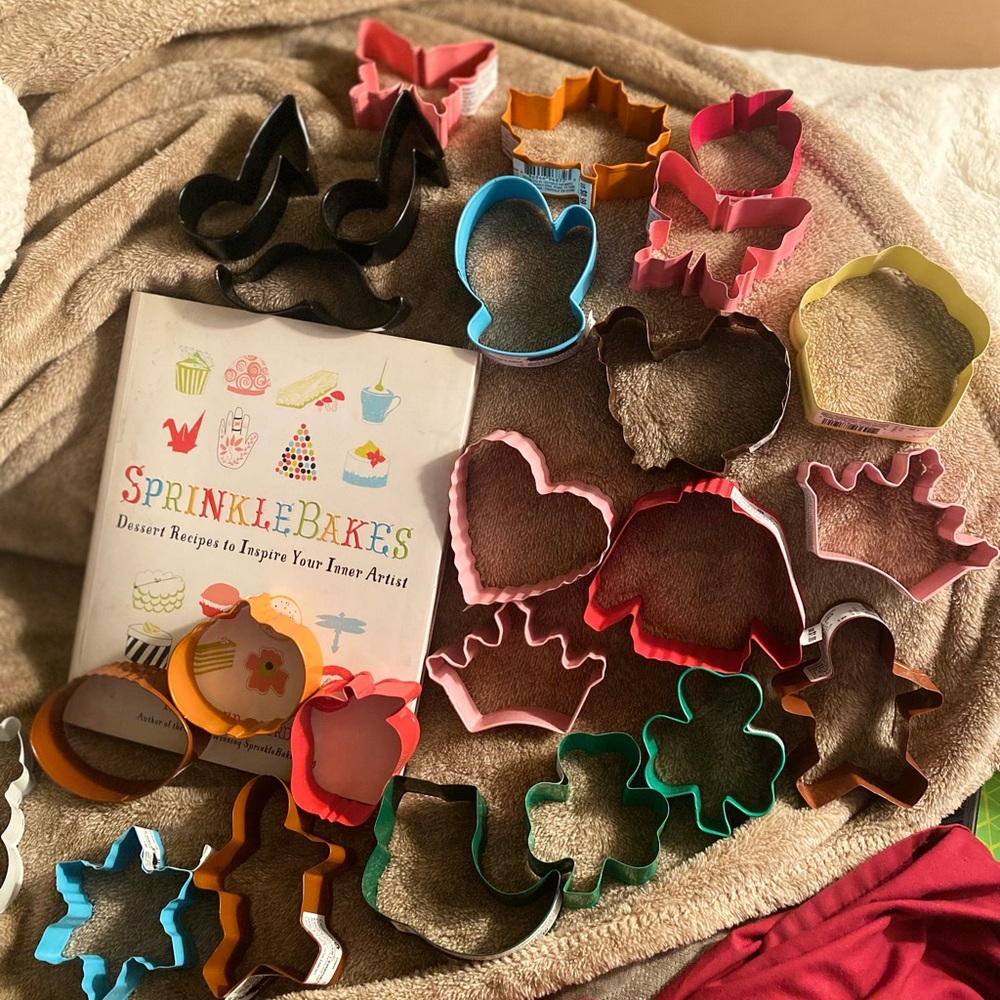 Dessert recipe book and 24 assorted metal cookie cutters
